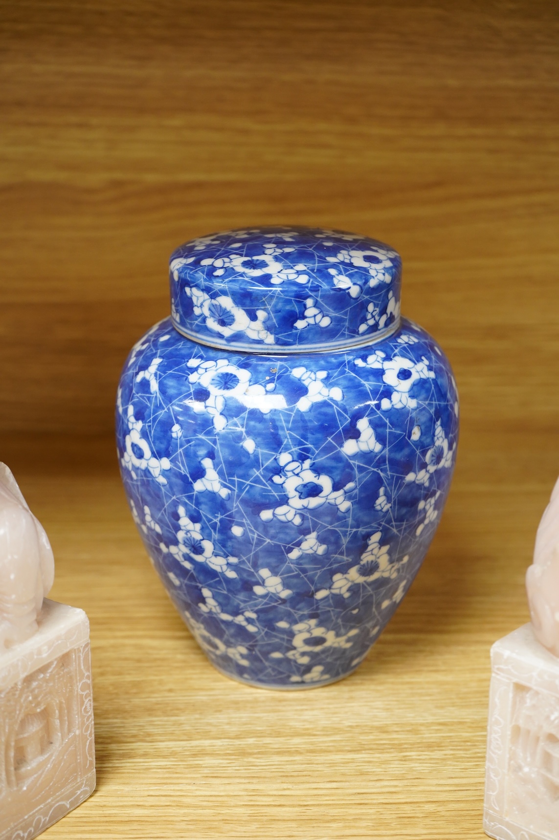 A pair of Chinese soapstone lion-dogs - 22.5cm high, two cloisonné enamel boxes and covers and a blue & white jar & cover